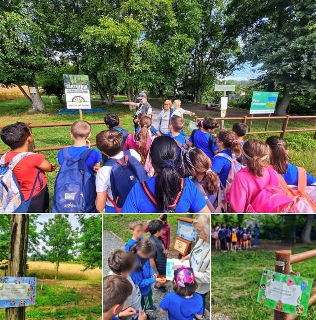 Bambini in cerchio nel parco di Montalupa e attività con i cartelli informativi